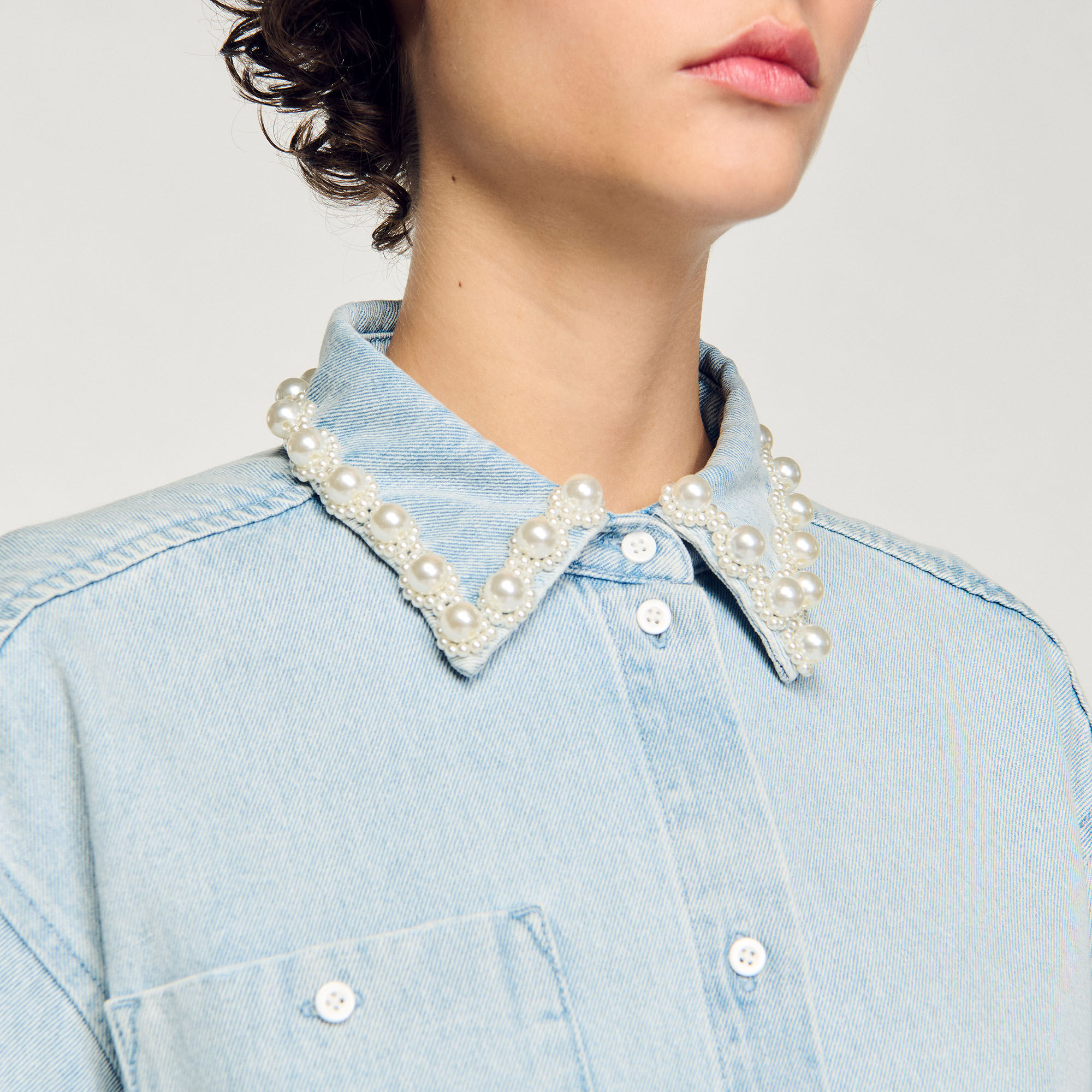 Denim shirt with beaded collar