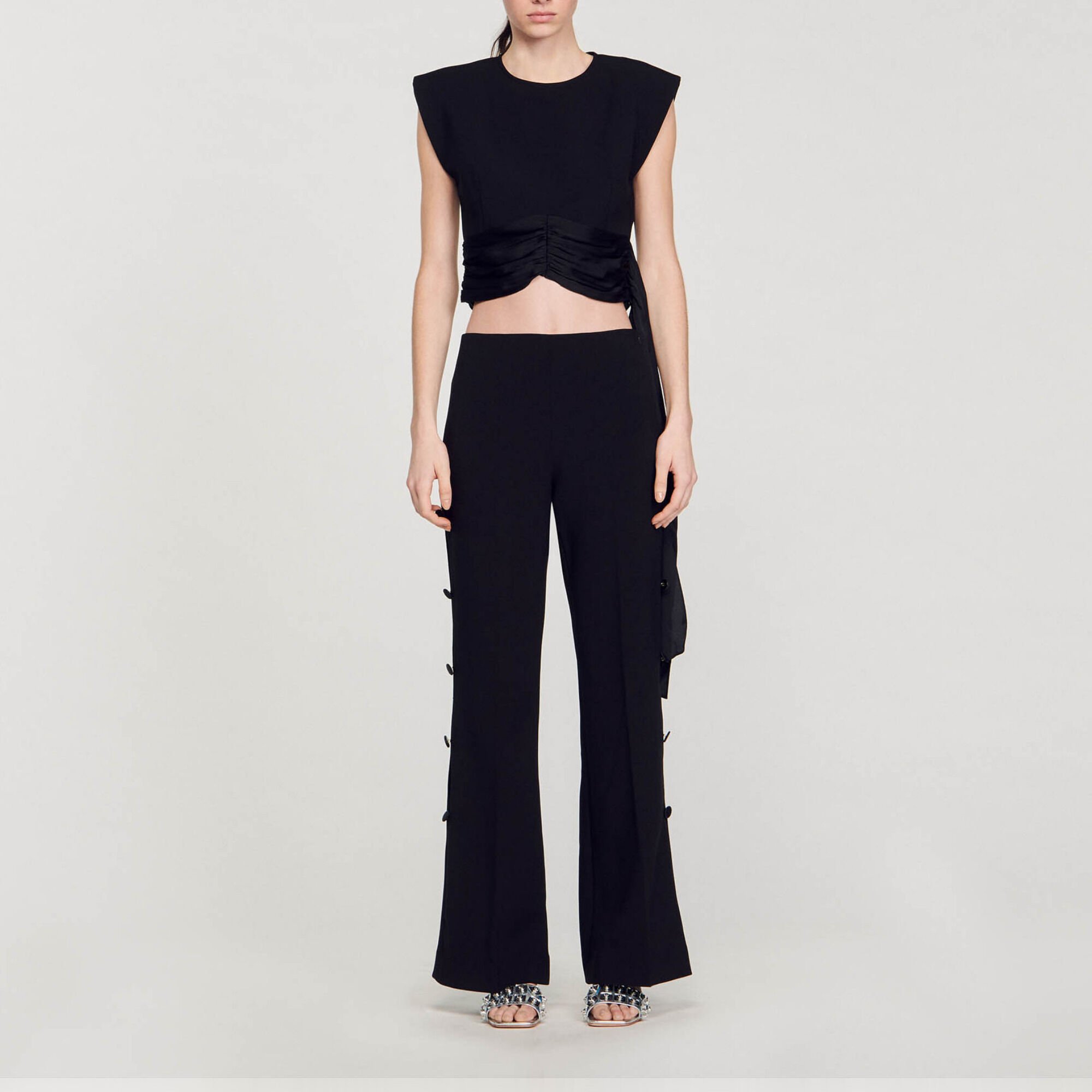 Flared trousers with cutaway sides