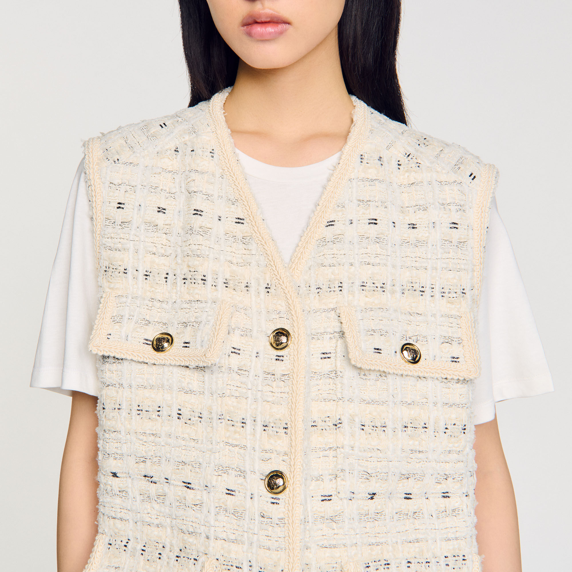 Sleeveless tweed jacket
