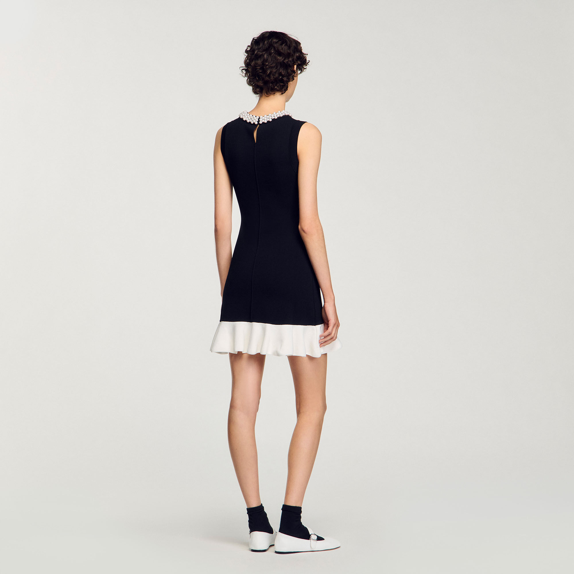 Short knit dress with beaded neck