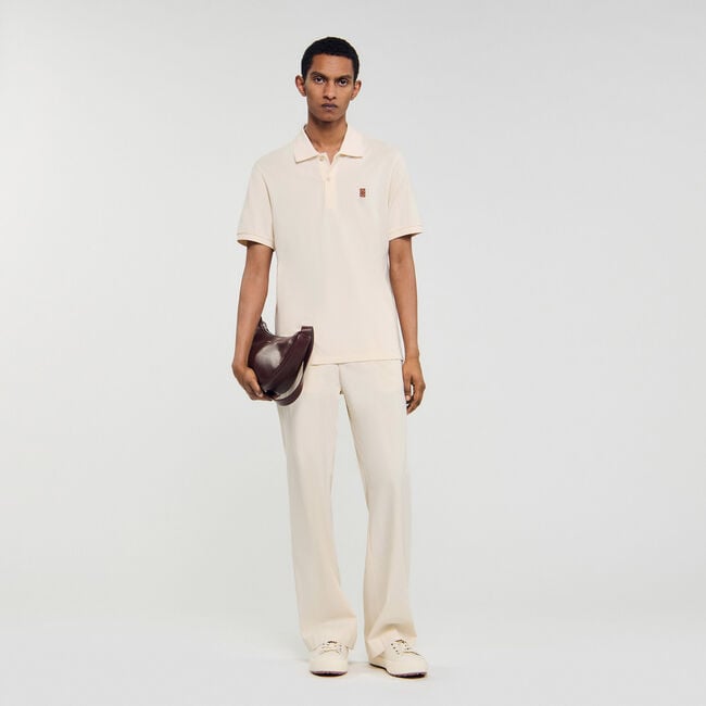 Polo shirt with leather logo