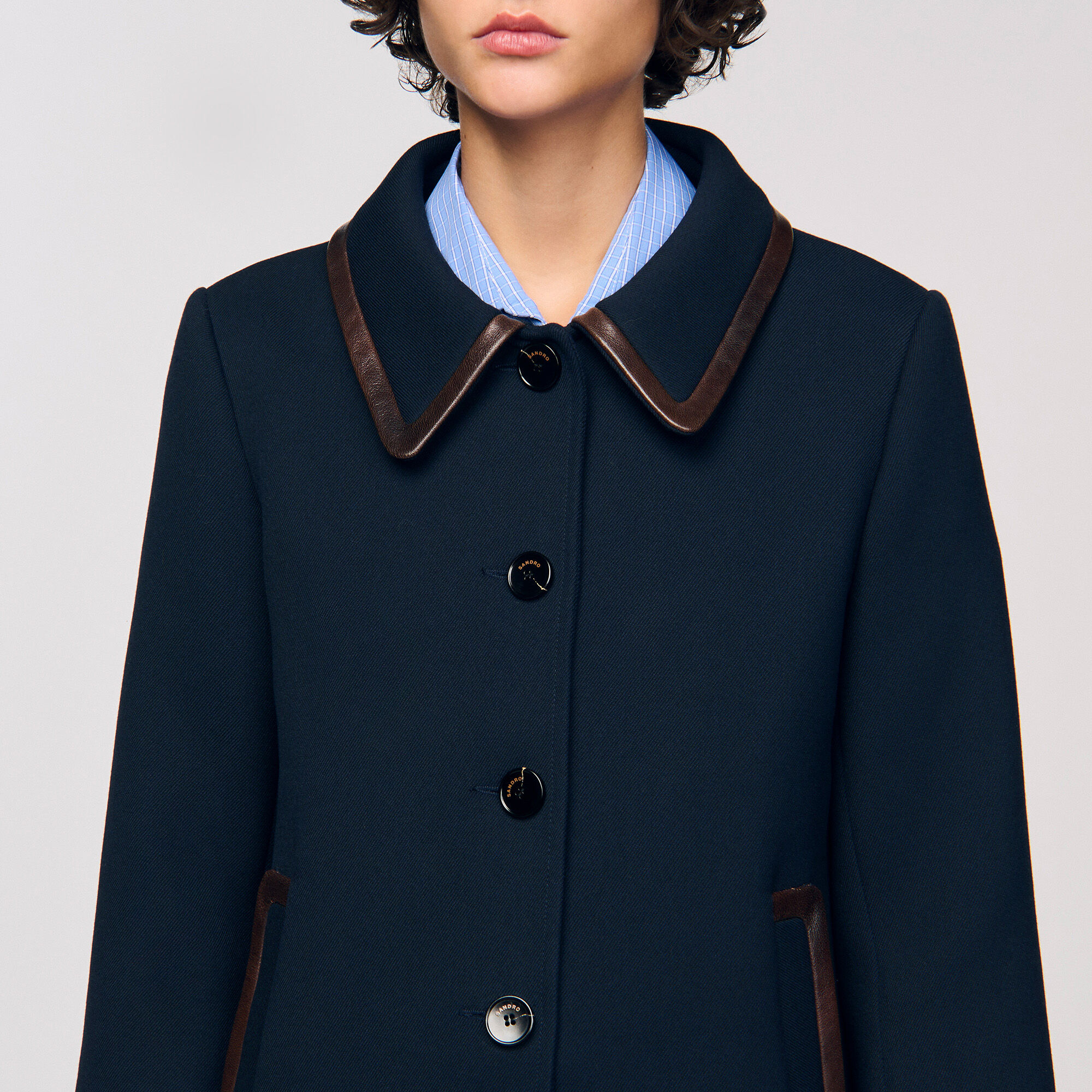 Coat with leather stripes