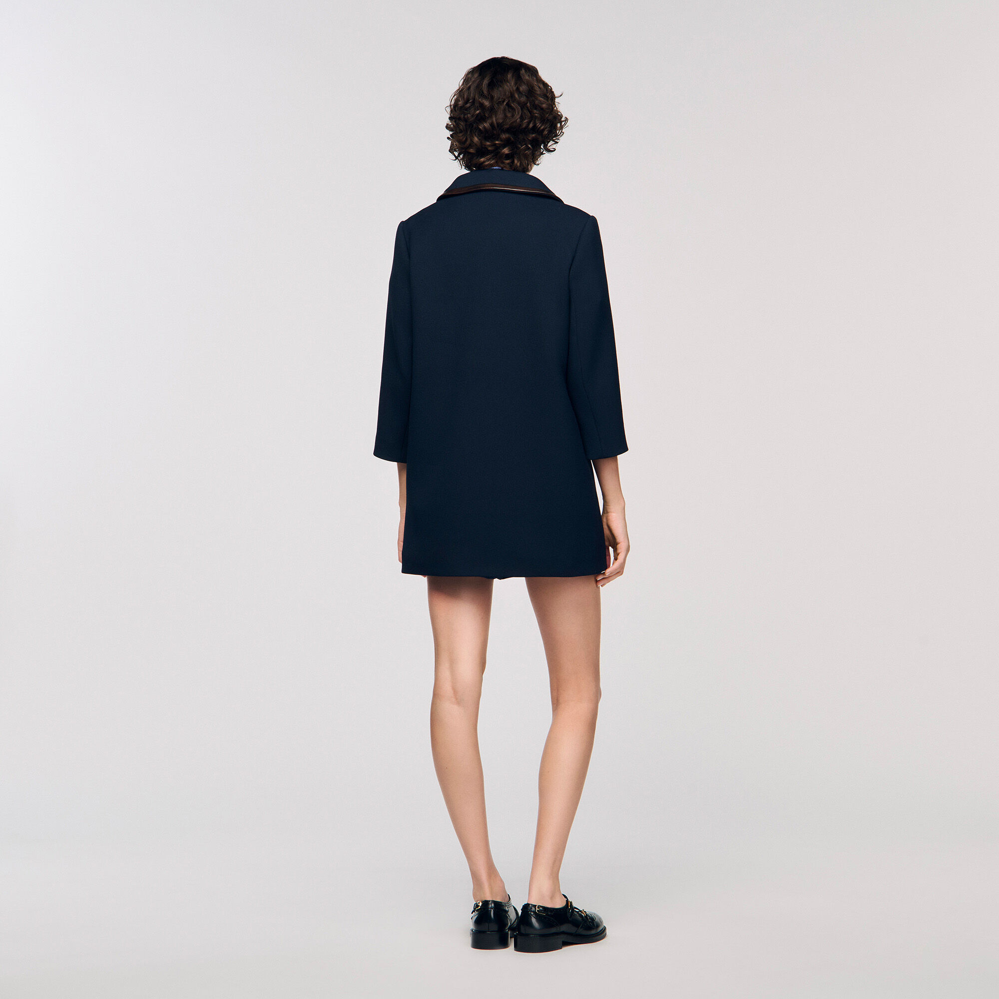Coat with leather stripes