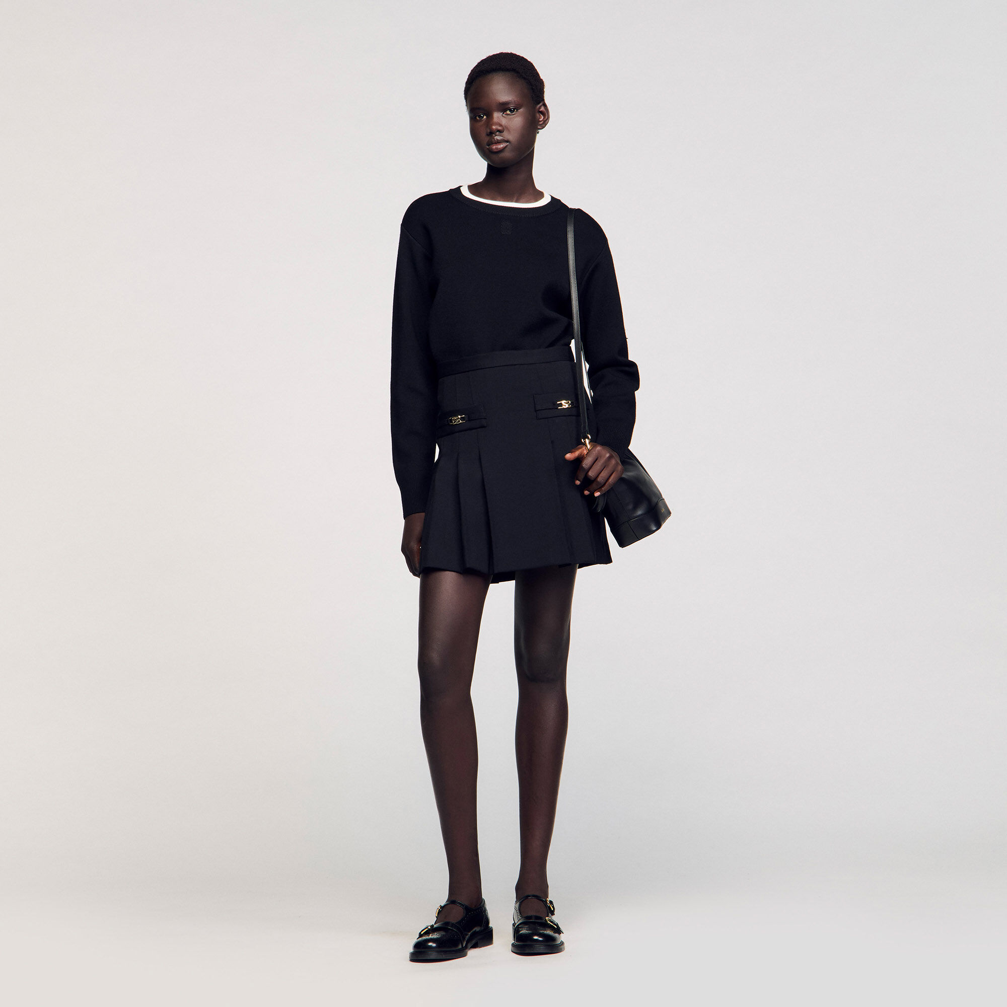 Short skirt with stitched pleats