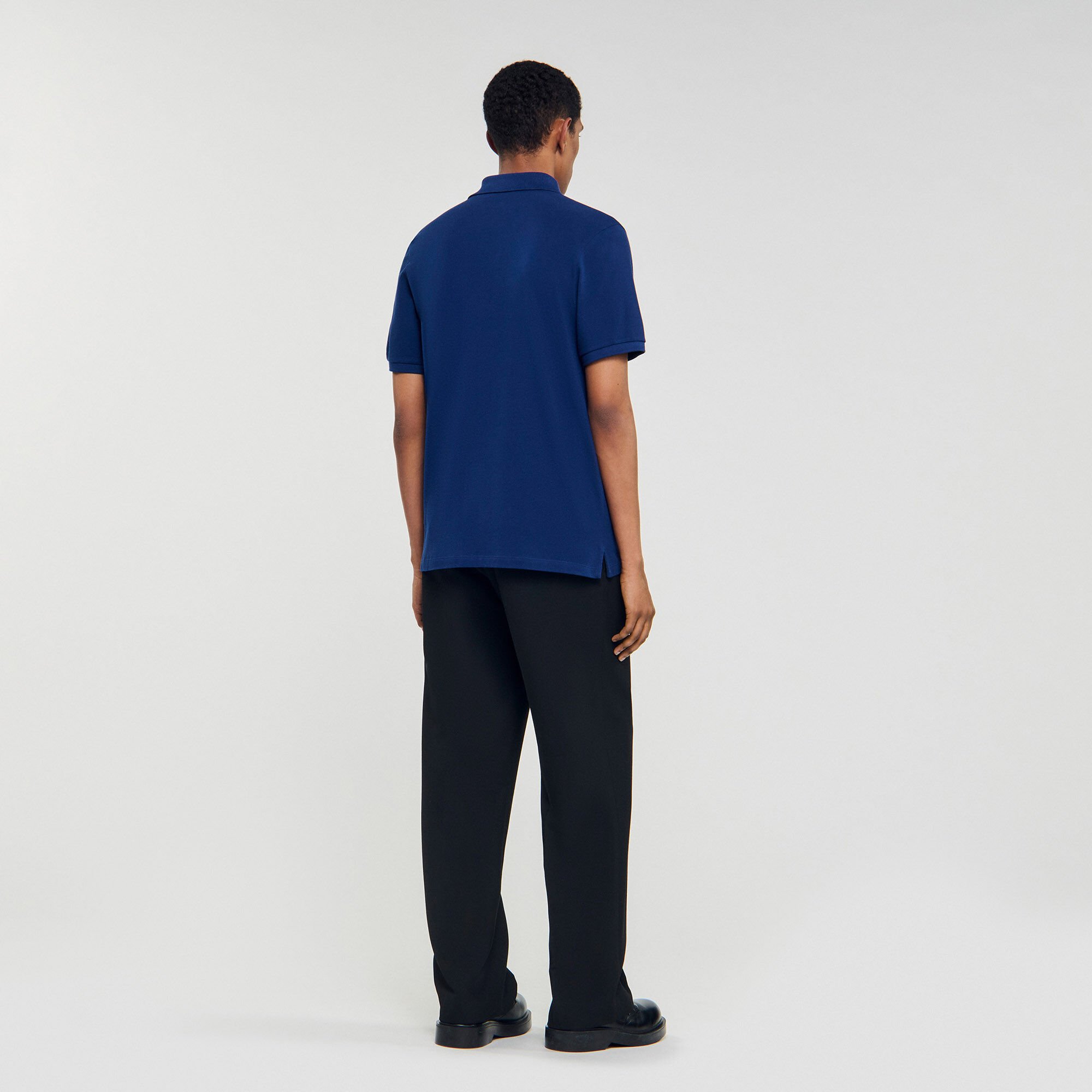 Polo shirt with leather logo