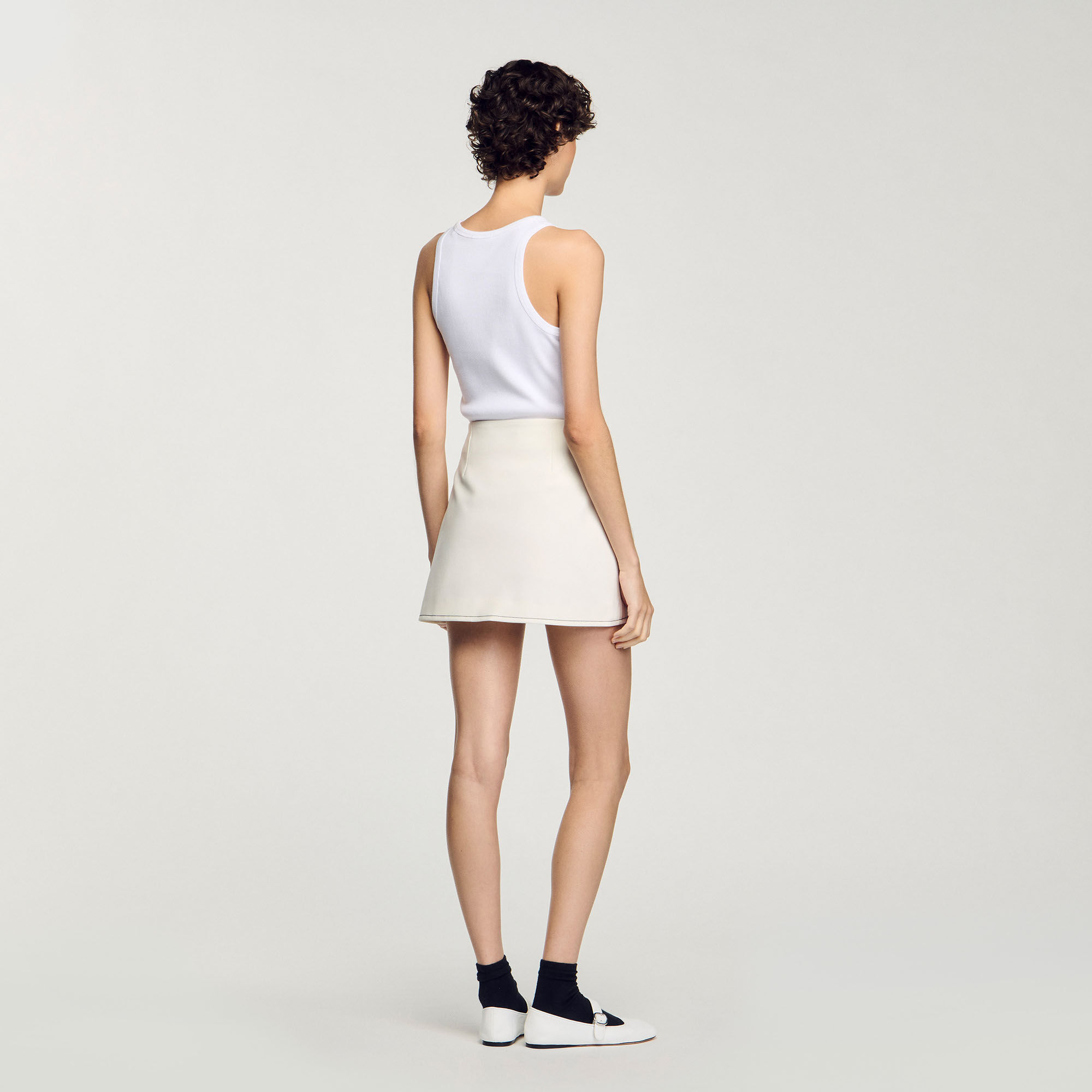 Short box-pleated skirt