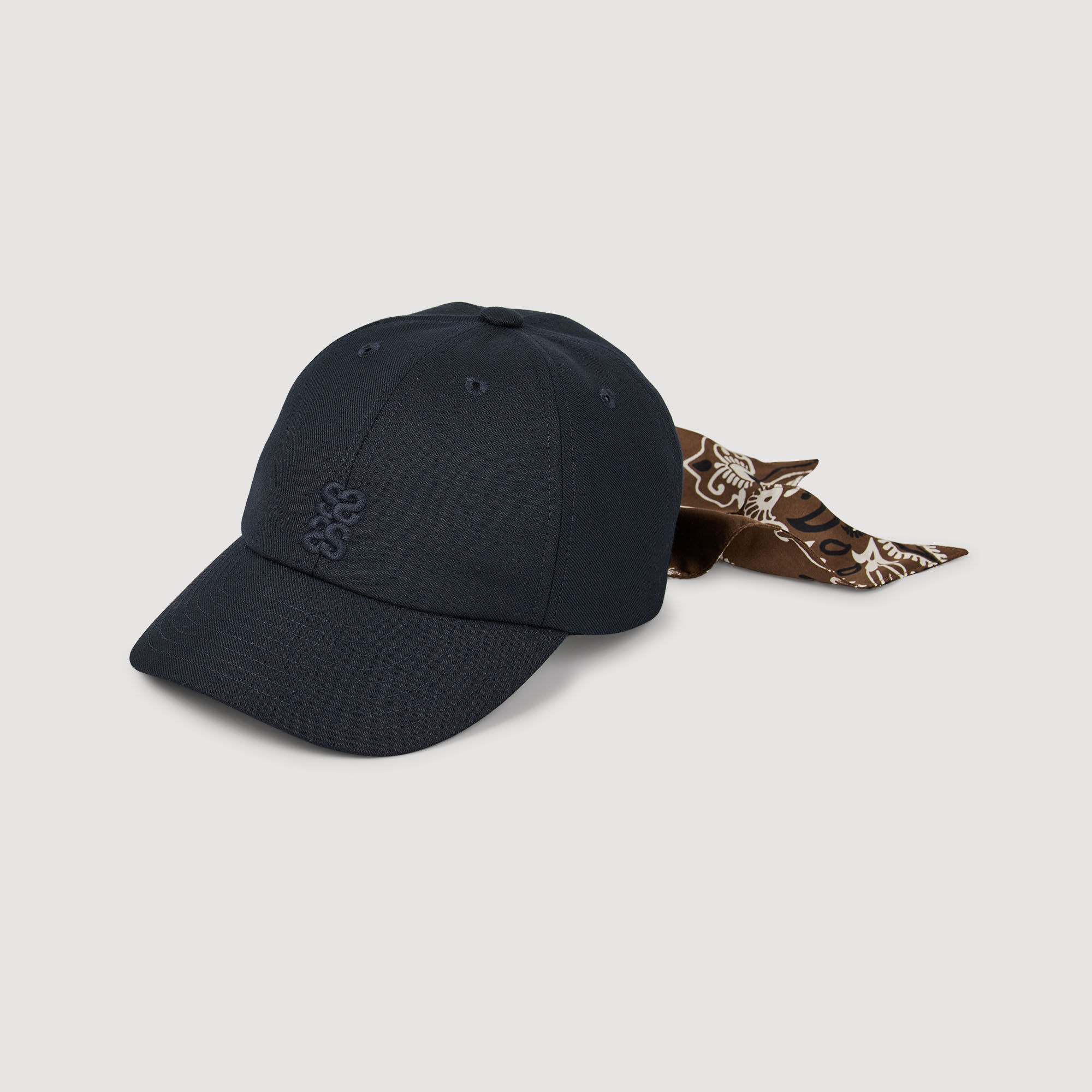 Cap with tied scarf
