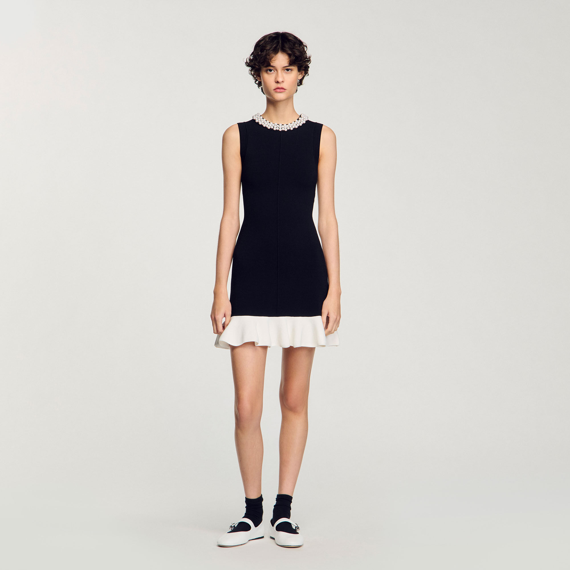 Short knit dress with beaded neck