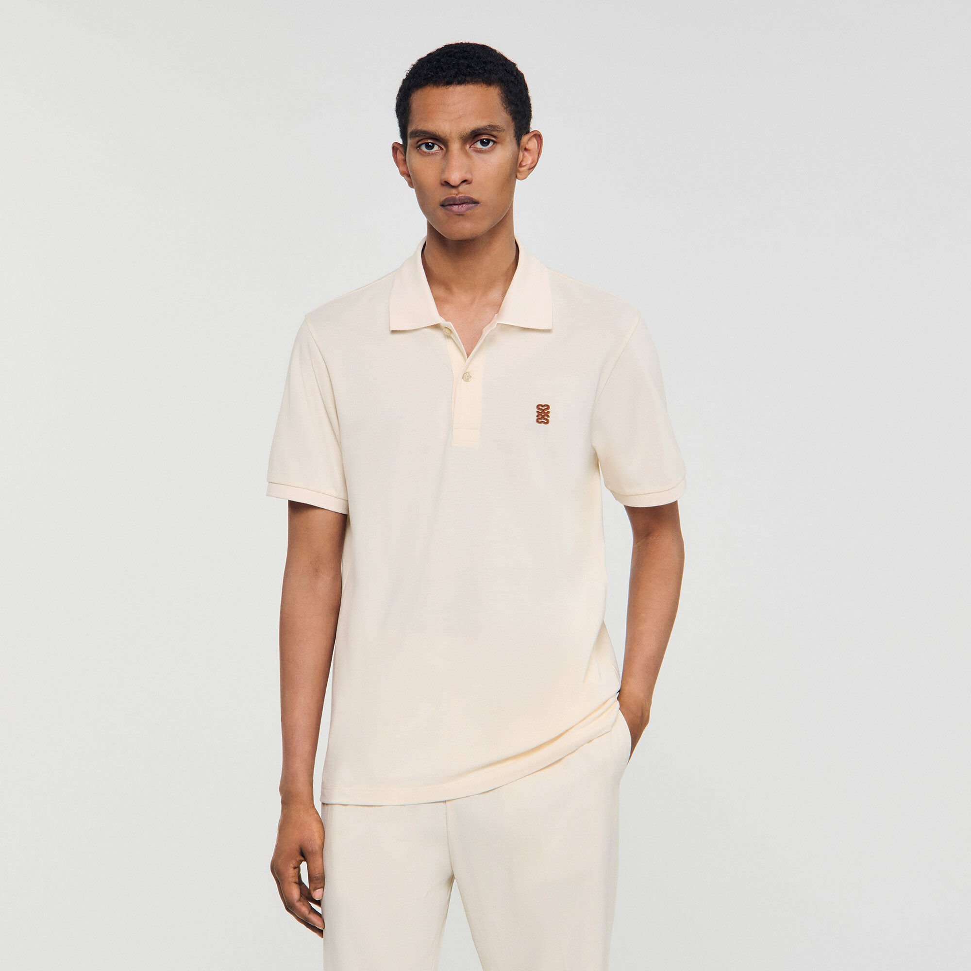 Polo shirt with leather logo