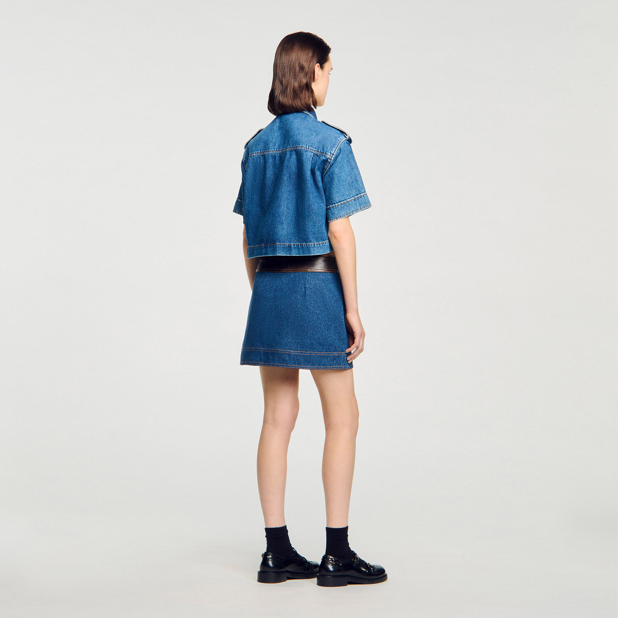 Short denim and leather skirt